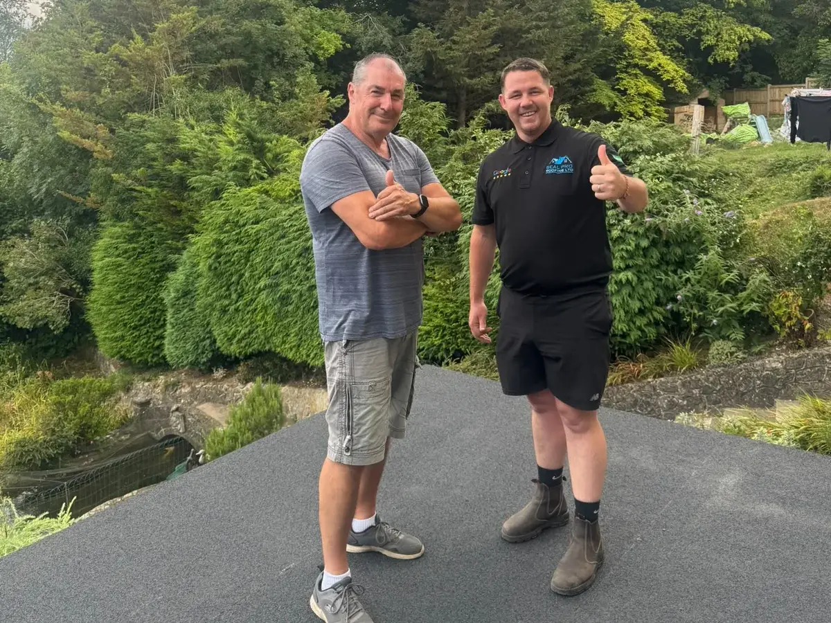 The customer with owner Cornelius on the finished flat roof in Chatham, Medway