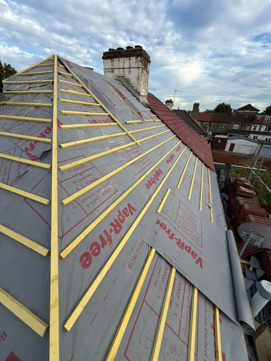 Hip set out with new battens and VapR-free membrane next to the chimney in East Ham