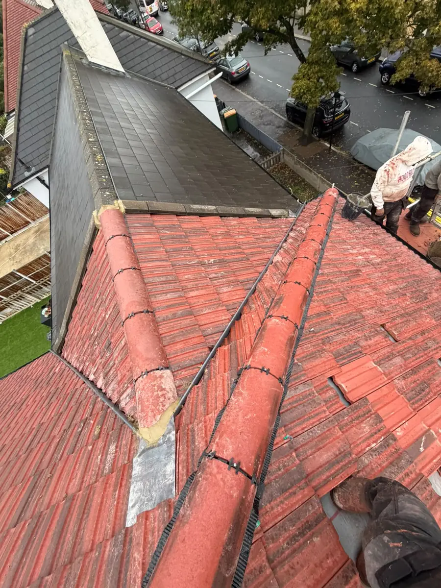 Two dry hips meeting with lead at the junction on the East Ham roof