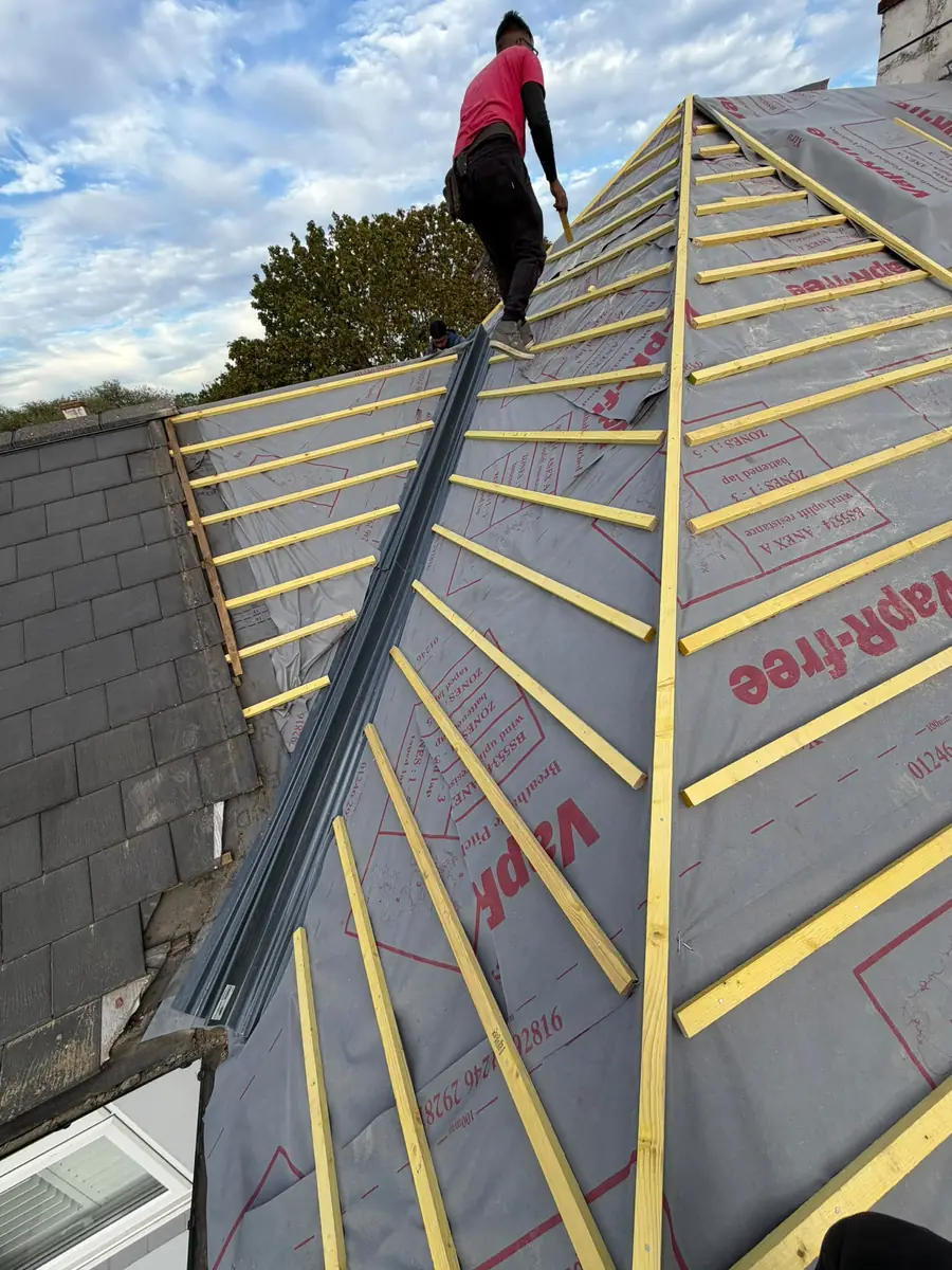 Valley being set out on the East Ham re-roof with battens cut in on both sides