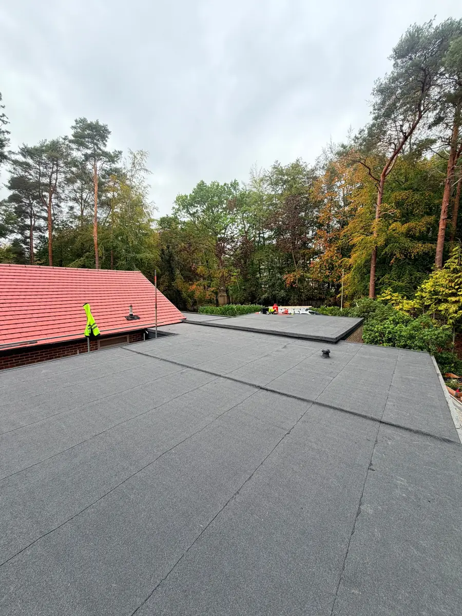 The finished large flat roof in Fleet with the new red tiled roof behind