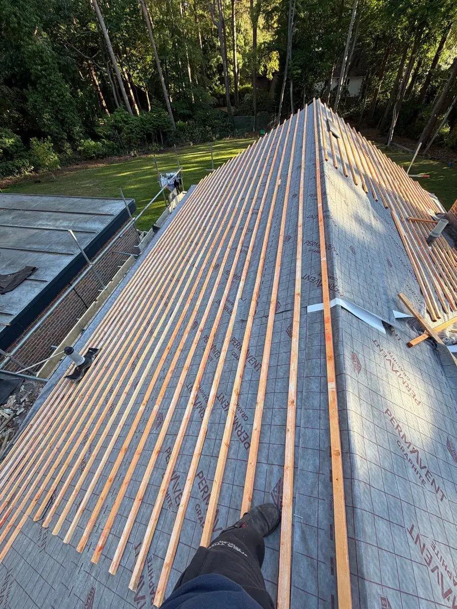 Permavent breathable roofing membrane with new treated battens set out up the slope in Fleet