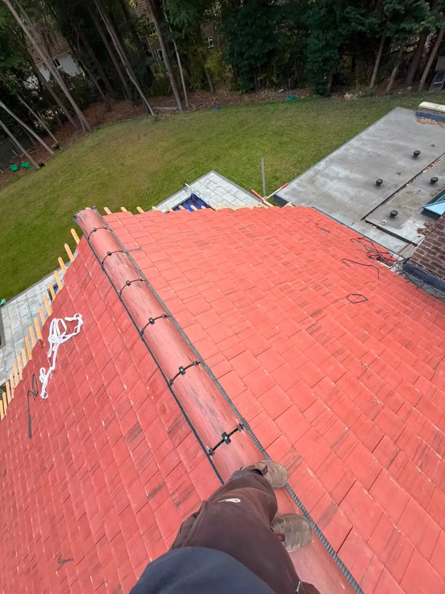 Mechanically fixed dry ridge with ridge clips on the new tiled roof in Fleet