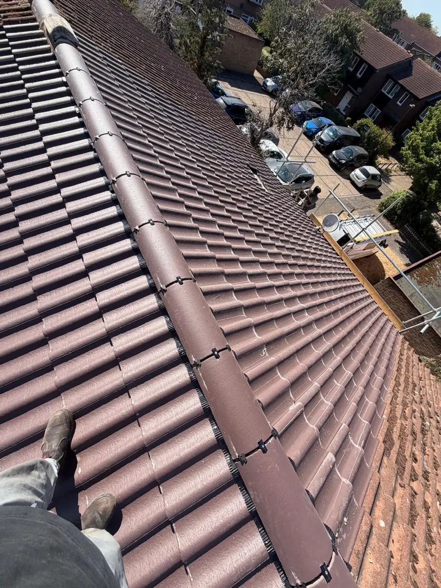 New interlocking tiles and a dry ridge on the finished re-roof in Hampton