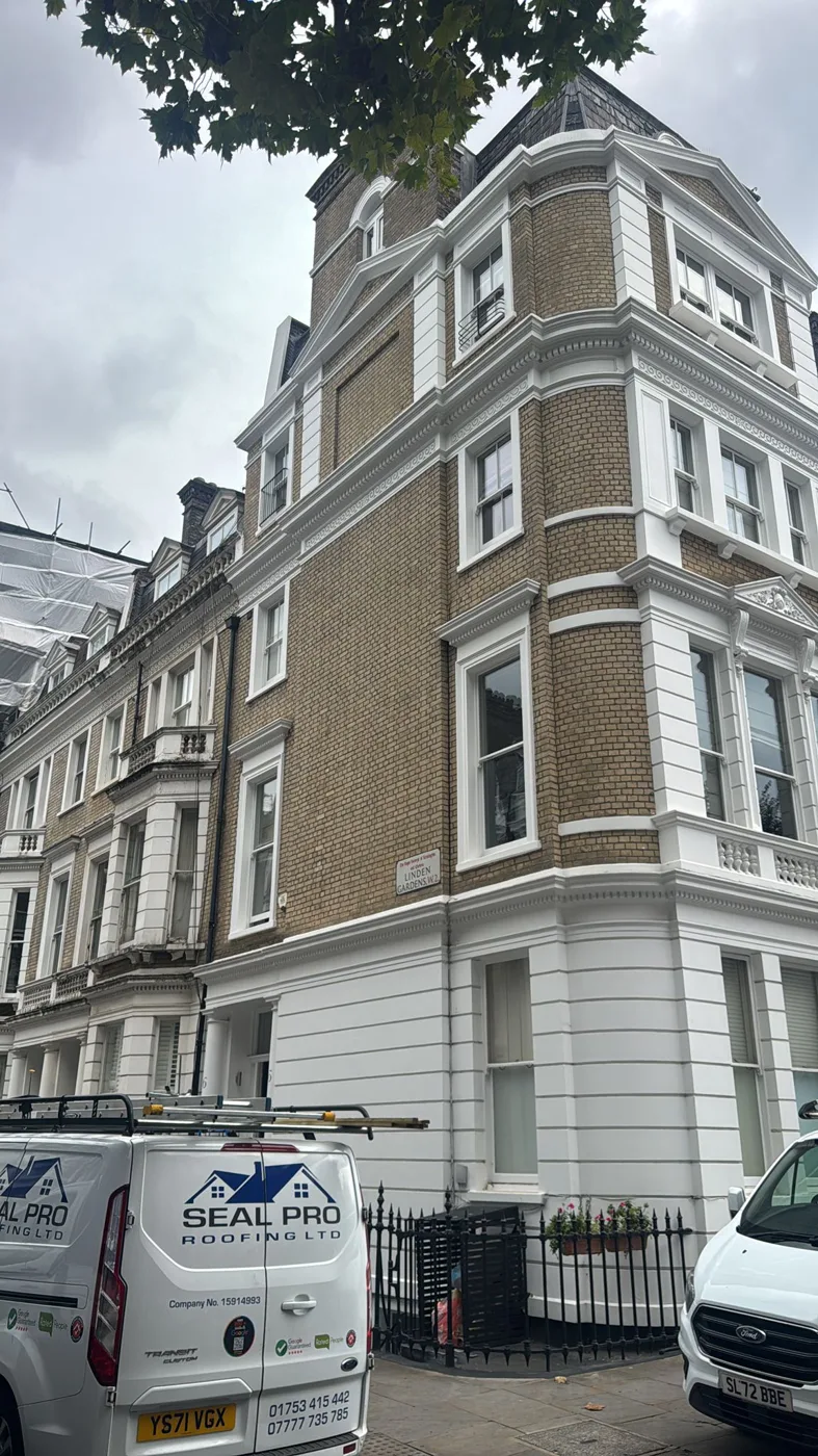 Seal Pro Roofing vans on site at a London period terrace